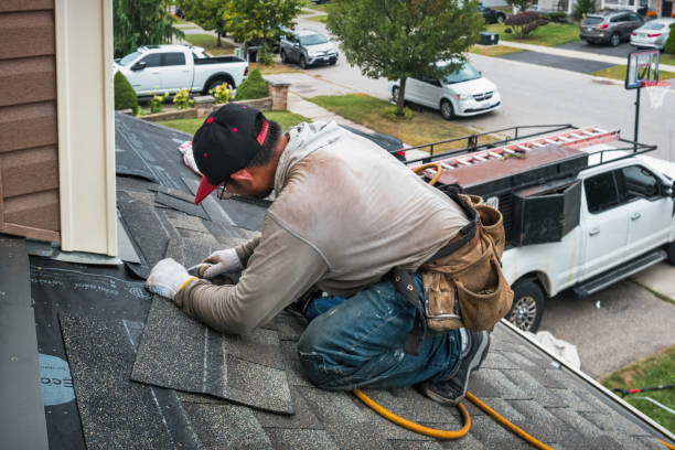 Professional Roofing technician working in Manchester, IA